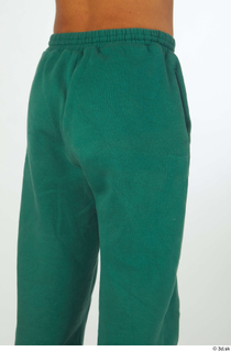 Nathaniel buttock dressed green jogging pants sports thigh 0004.jpg